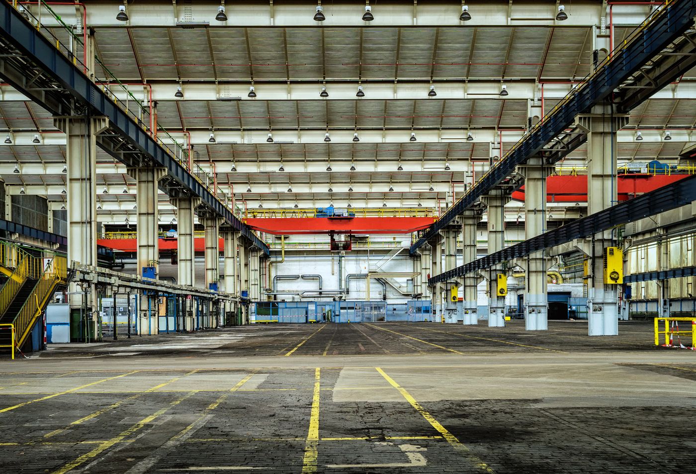 Empty production hall with overhead cranes